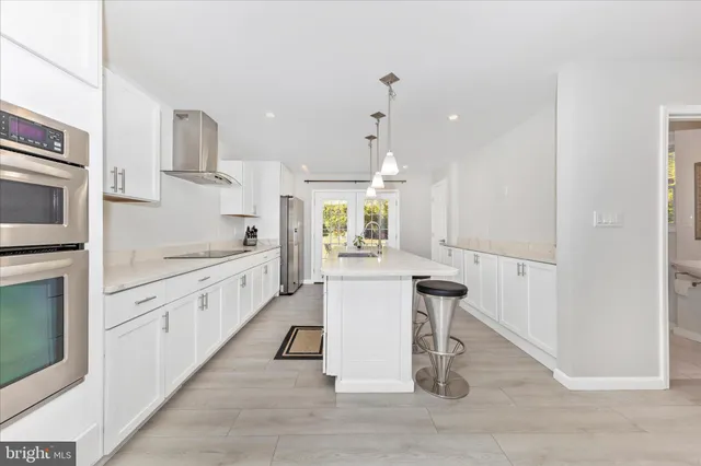 a kitchen with a sink cabinets and window
