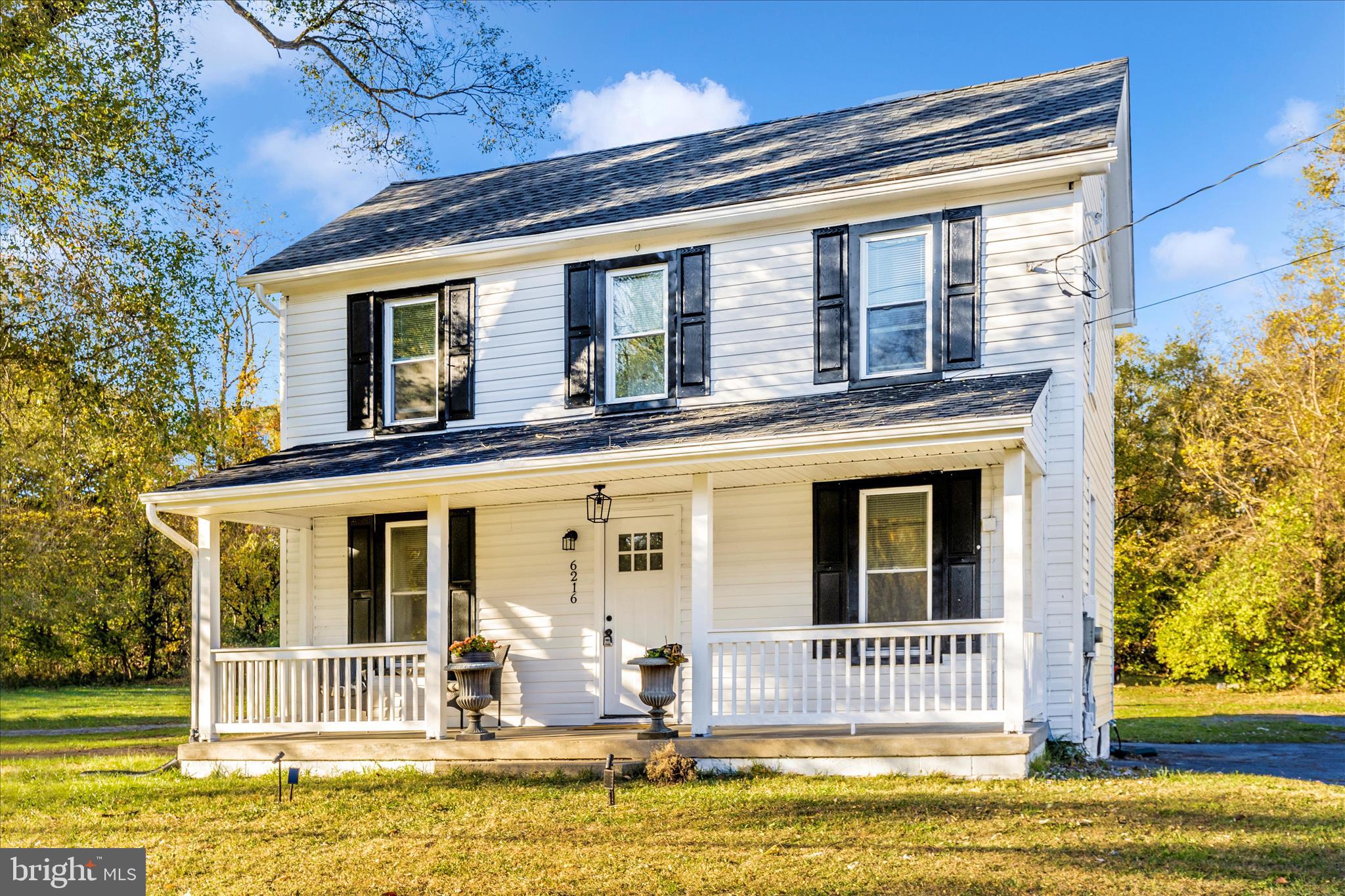 6216 Manor Woods Road Frederick, MD 21703 - Photo 36 of 45 a house view with a swimming pool in front of it