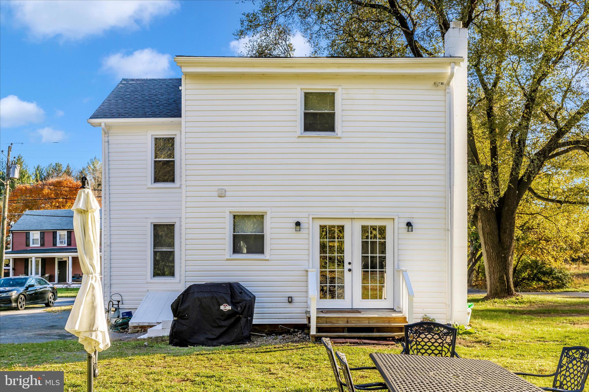 6216 Manor Woods Road Frederick, MD 21703 - Photo 41 of 45 a front view of a house with a yard
