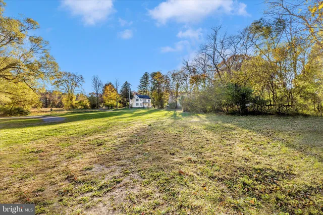a view of a swimming pool with an outdoor space and seating area