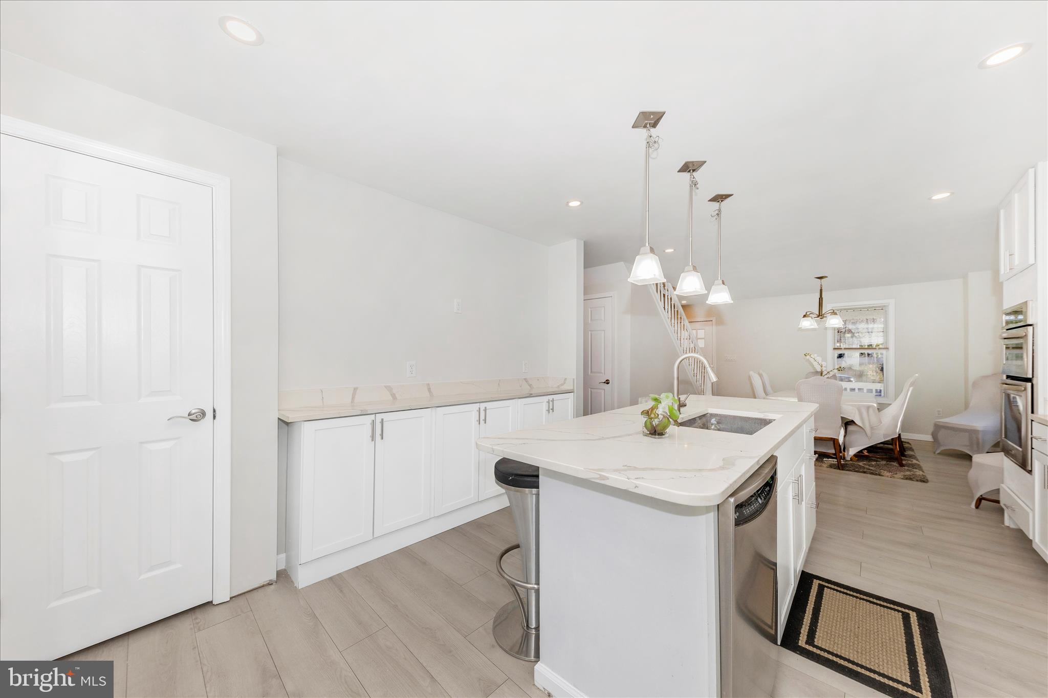 6216 Manor Woods Road Frederick, MD 21703 - Photo 6 of 45 a kitchen with a sink a counter space and wooden floor