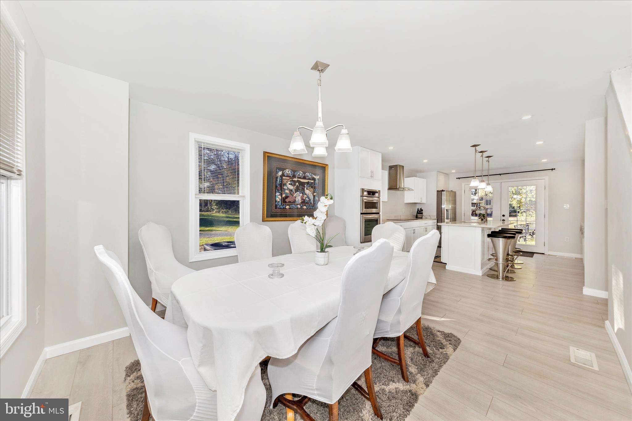 6216 Manor Woods Road Frederick, MD 21703 - Photo 9 of 45 a view of a dining room with furniture window and outside view