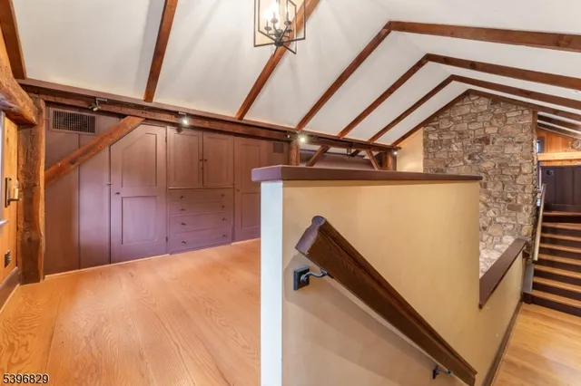 a bathroom with a shower and a glass door