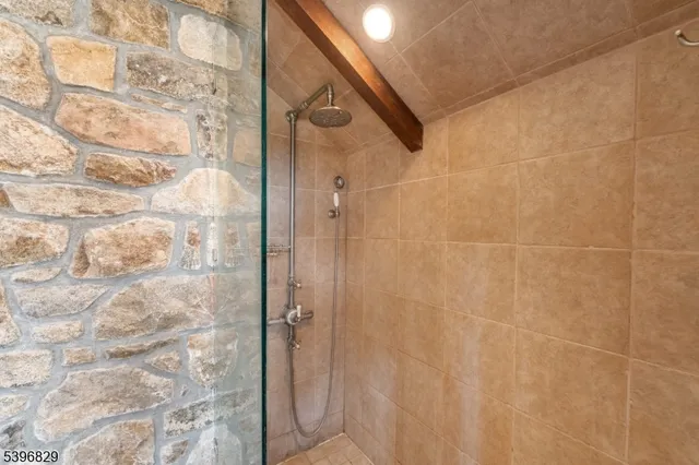 a view of a lounge chair and table in the backyard