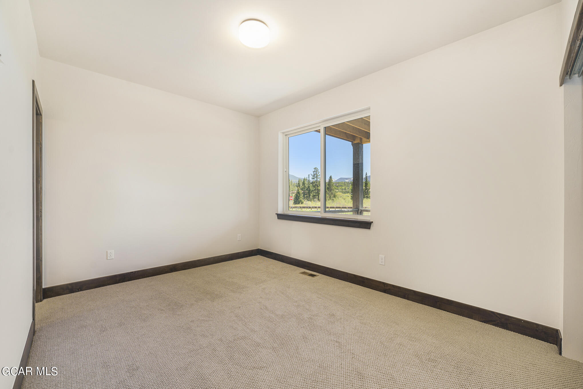 119 Homestead Loop Fraser, CO 80442 - Photo 18 of 22 an empty room with windows