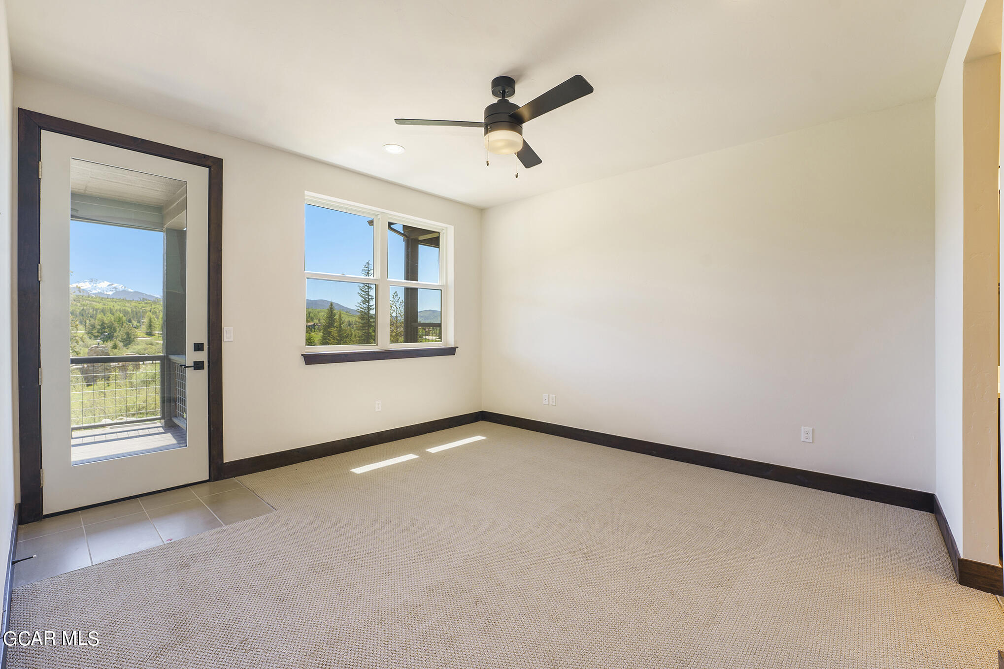 119 Homestead Loop Fraser, CO 80442 - Photo 10 of 22 a view of a livingroom with a ceiling fan and window