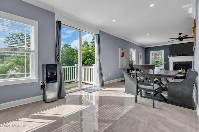 a view of a livingroom with furniture and a window