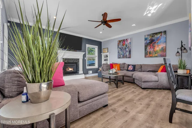 a living room with furniture fireplace and a flat screen tv