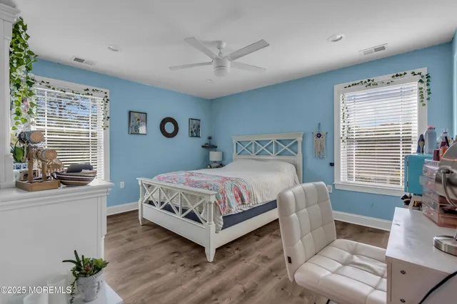 a spacious bedroom with a bed and a couch