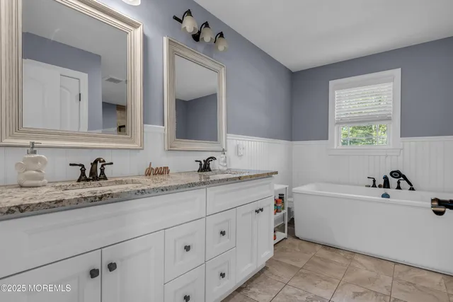 a bathroom with a sink and a bathtub