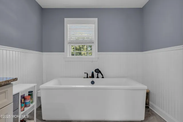 a bathroom with a sink and a window