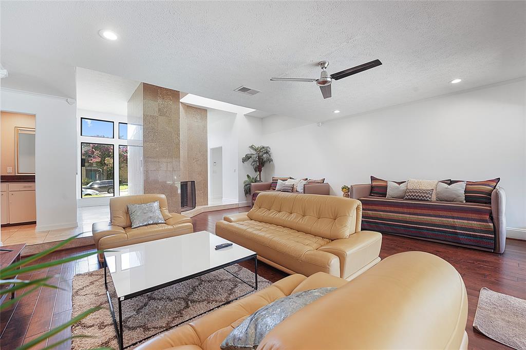 9677 Fallbrook Drive Dallas, TX 75243 - Photo 12 of 40 a living room with furniture and a large window