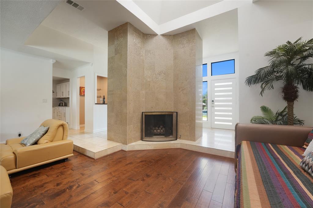 9677 Fallbrook Drive Dallas, TX 75243 - Photo 13 of 40 a living room with furniture and a fireplace