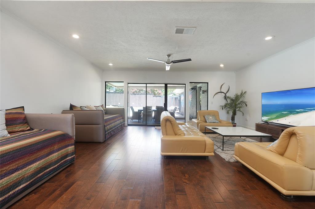 9677 Fallbrook Drive Dallas, TX 75243 - Photo 14 of 40 a living room with furniture and a large window