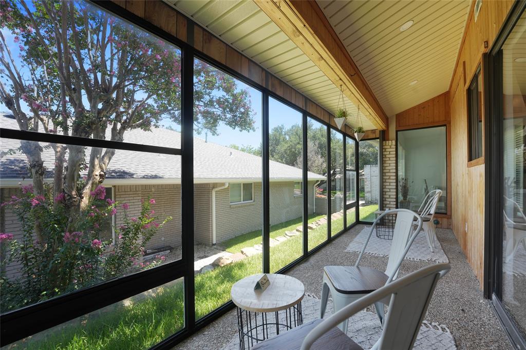 9677 Fallbrook Drive Dallas, TX 75243 - Photo 2 of 40 a view of a floor to ceiling window and wooden floor