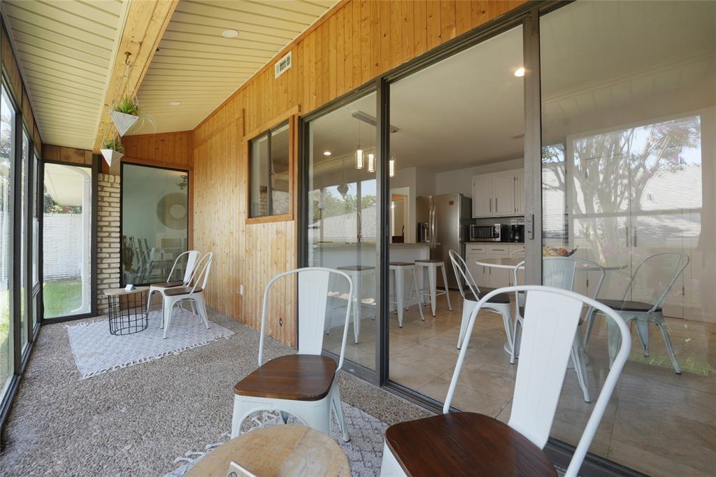 9677 Fallbrook Drive Dallas, TX 75243 - Photo 35 of 40 a view of a dining room with furniture wooden floor and a potted plant