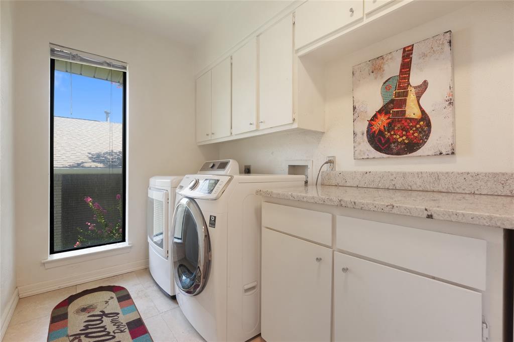 9677 Fallbrook Drive Dallas, TX 75243 - Photo 37 of 40 a view of bathroom with washer and dryer