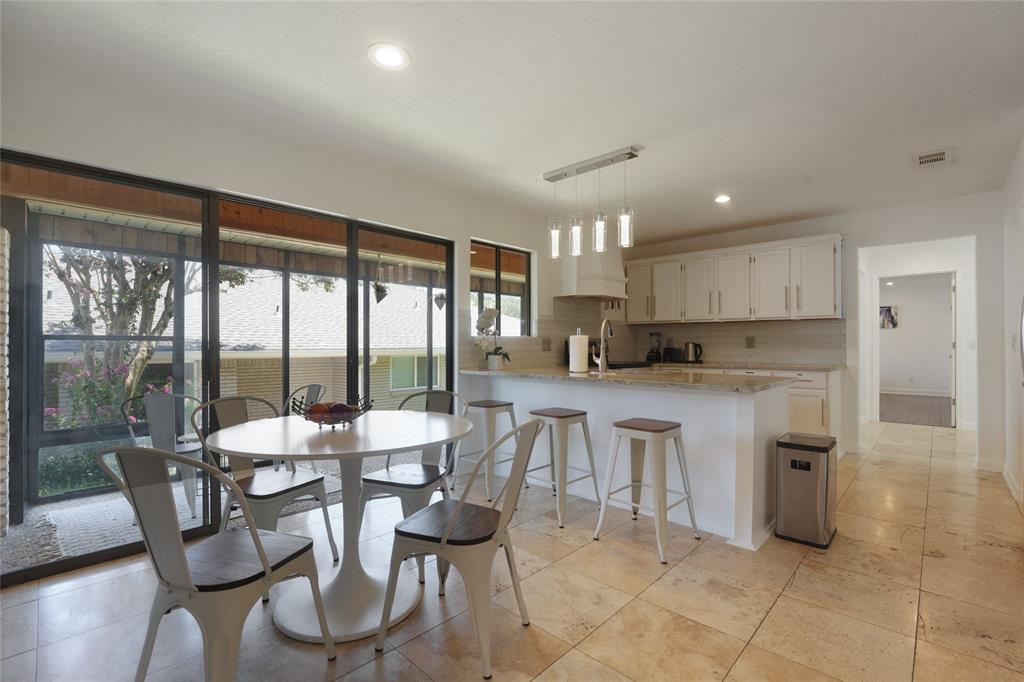 9677 Fallbrook Drive Dallas, TX 75243 - Photo 4 of 40 a view of a dining room with furniture window and outside view