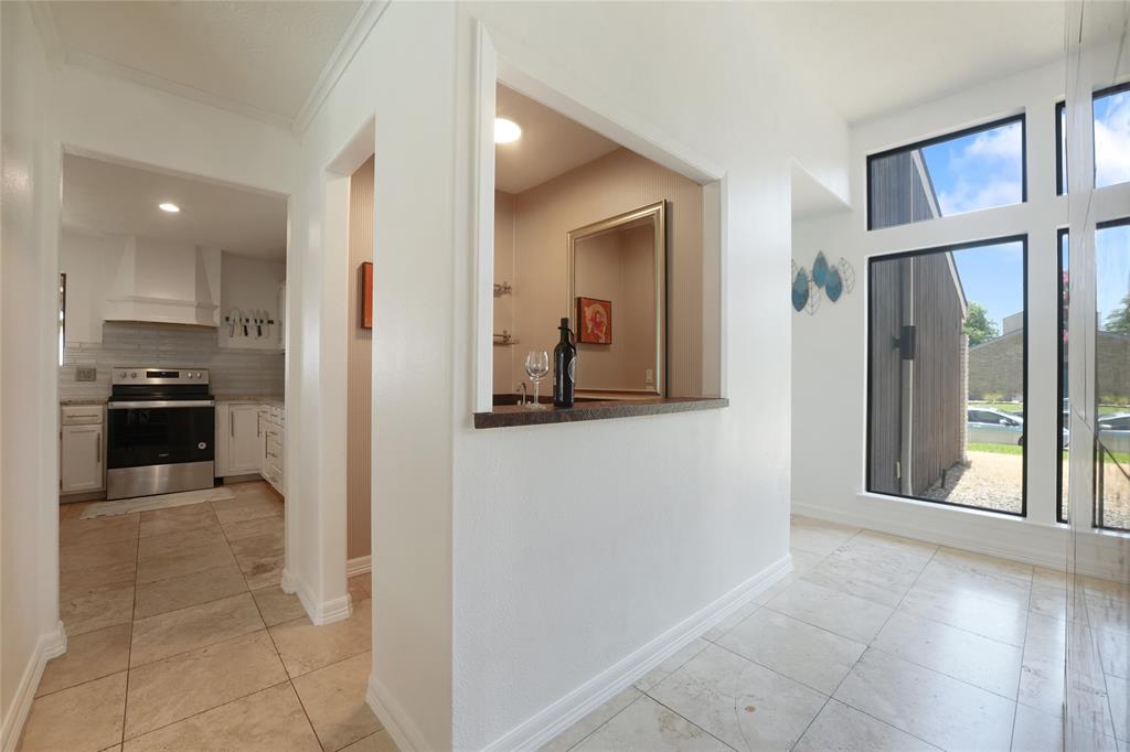 9677 Fallbrook Drive Dallas, TX 75243 - Photo 9 of 40 a view of a kitchen from the hallway