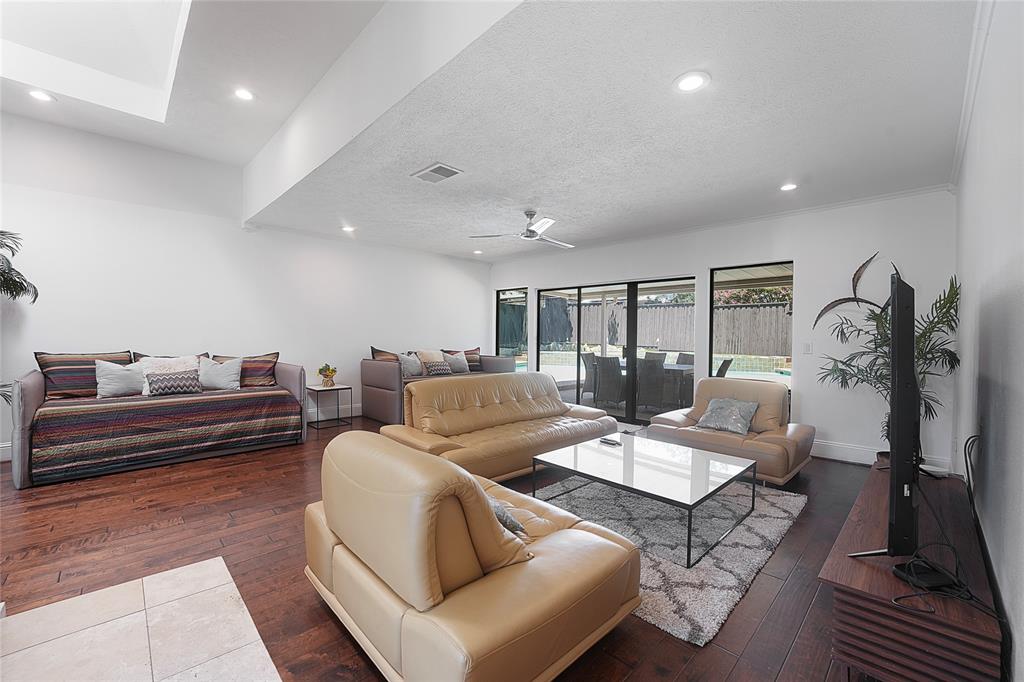9677 Fallbrook Drive Dallas, TX 75243 - Photo 10 of 40 a living room with furniture and wooden floor