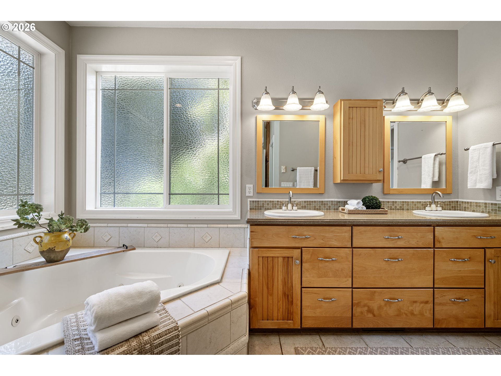 2218 Willow Loop Florence, OR 97439 - Photo 17 of 47 a bathroom with a granite countertop sink and a mirror