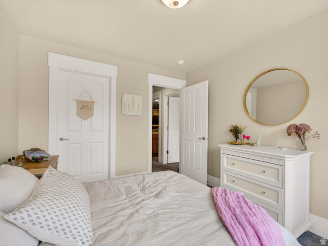557 Craftsman Way Midway, UT 84049 - Photo 37 of 59 Bedroom featuring light-toned walls, white trim, and a flush mount light fixture