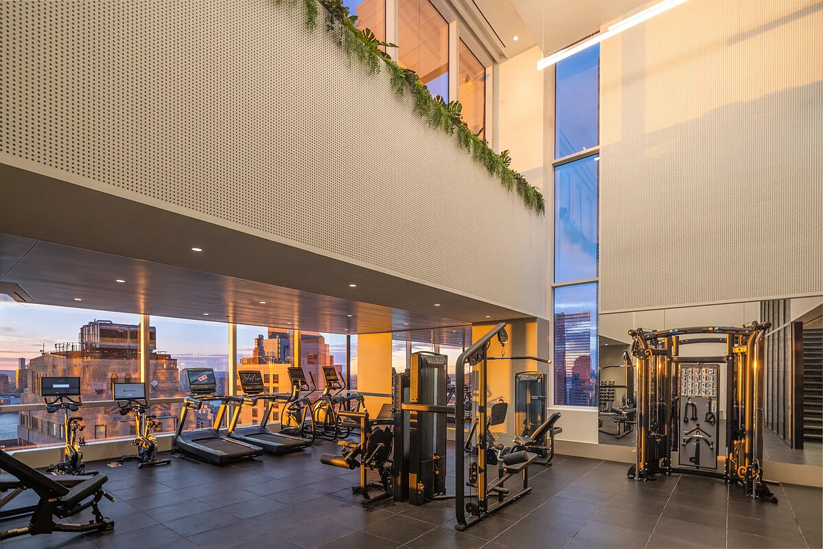 77 Greenwich Street, Unit 23C Manhattan, NY 10006 - Photo 15 of 18 a view of a room with gym equipment