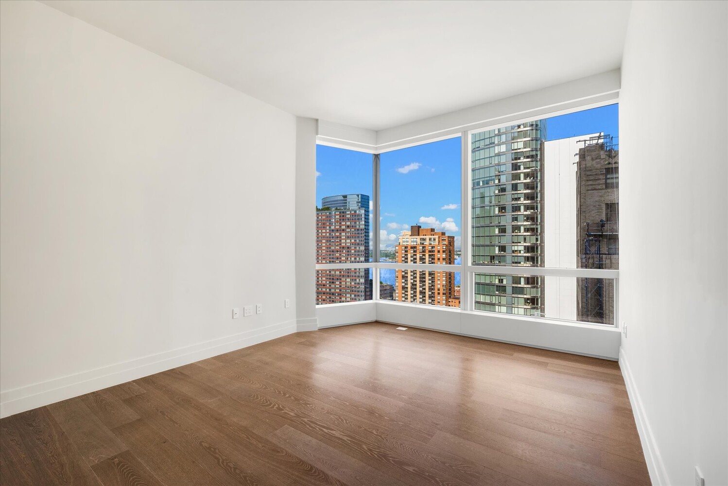 77 Greenwich Street, Unit 23C Manhattan, NY 10006 - Photo 4 of 18 a view of an empty room with a window