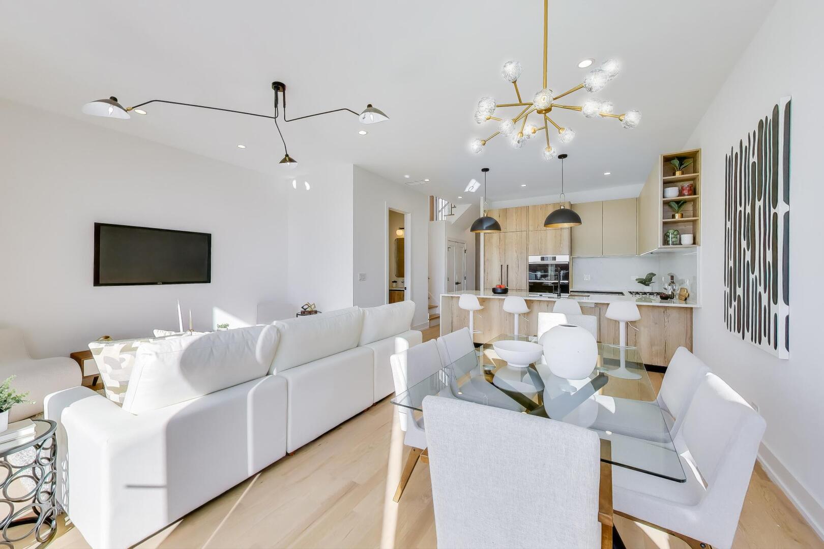 2456 West Cortez Street, Unit 3E Chicago, IL 60622 - Photo 11 of 46 a living room with furniture kitchen view and a chandelier