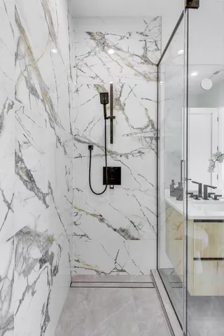 a bathroom with a sink and mirror