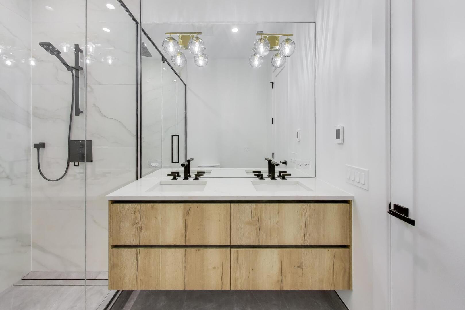2456 West Cortez Street, Unit 3E Chicago, IL 60622 - Photo 22 of 46 a bathroom with a sink and mirror