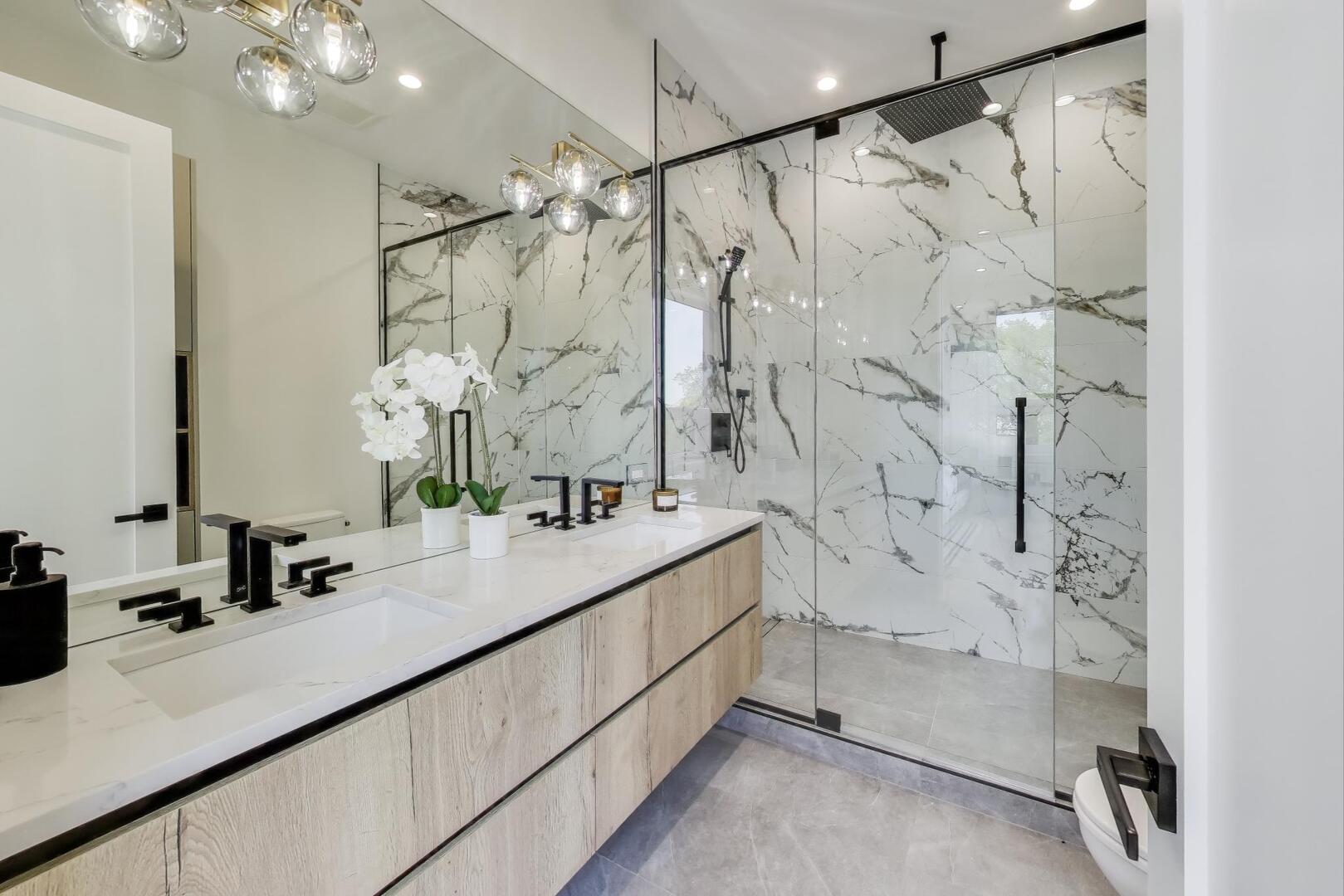 2456 West Cortez Street, Unit 3E Chicago, IL 60622 - Photo 24 of 46 a bathroom with a double vanity sink mirror and shower