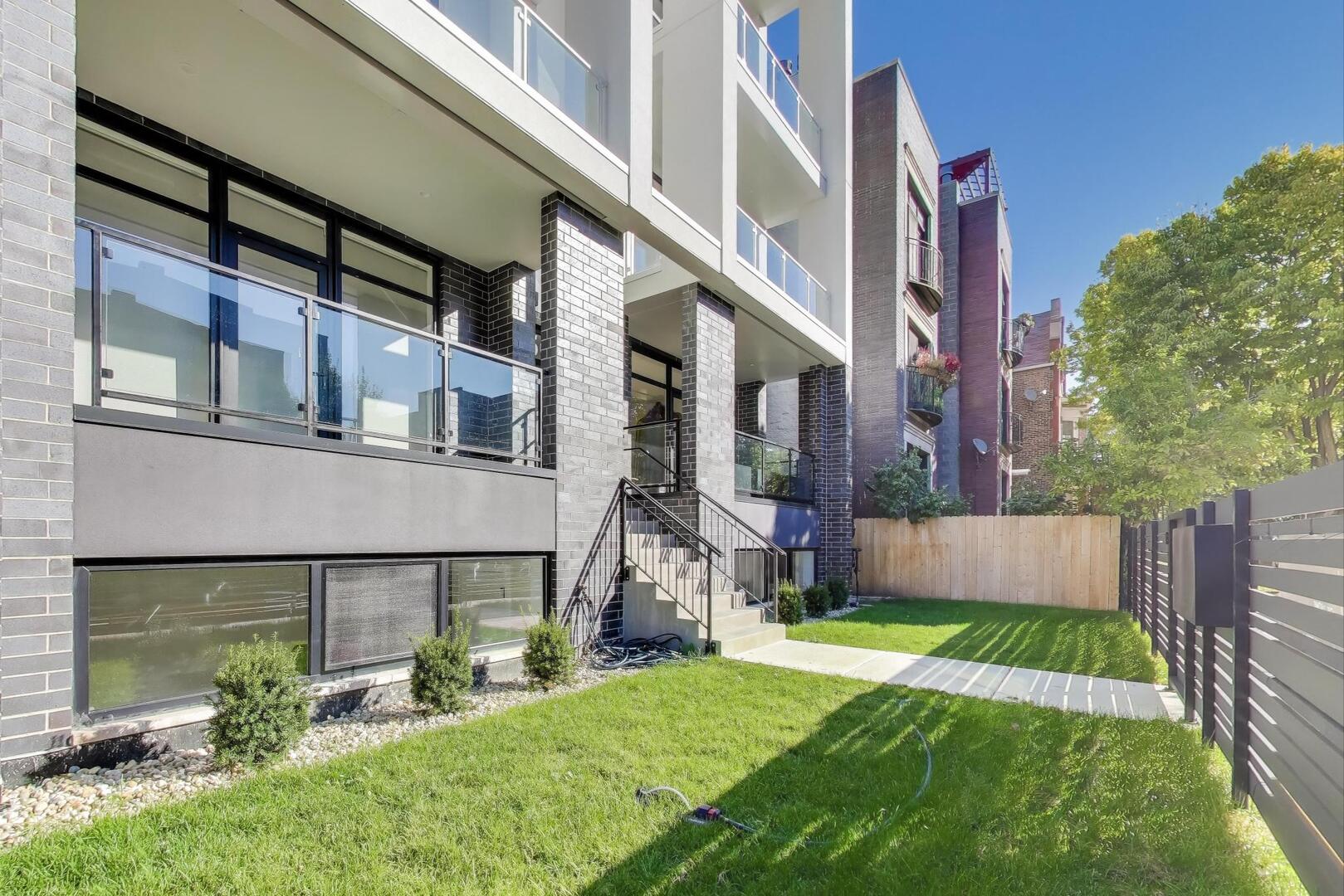 2456 West Cortez Street, Unit 3E Chicago, IL 60622 - Photo 4 of 46 a view of a building with a yard