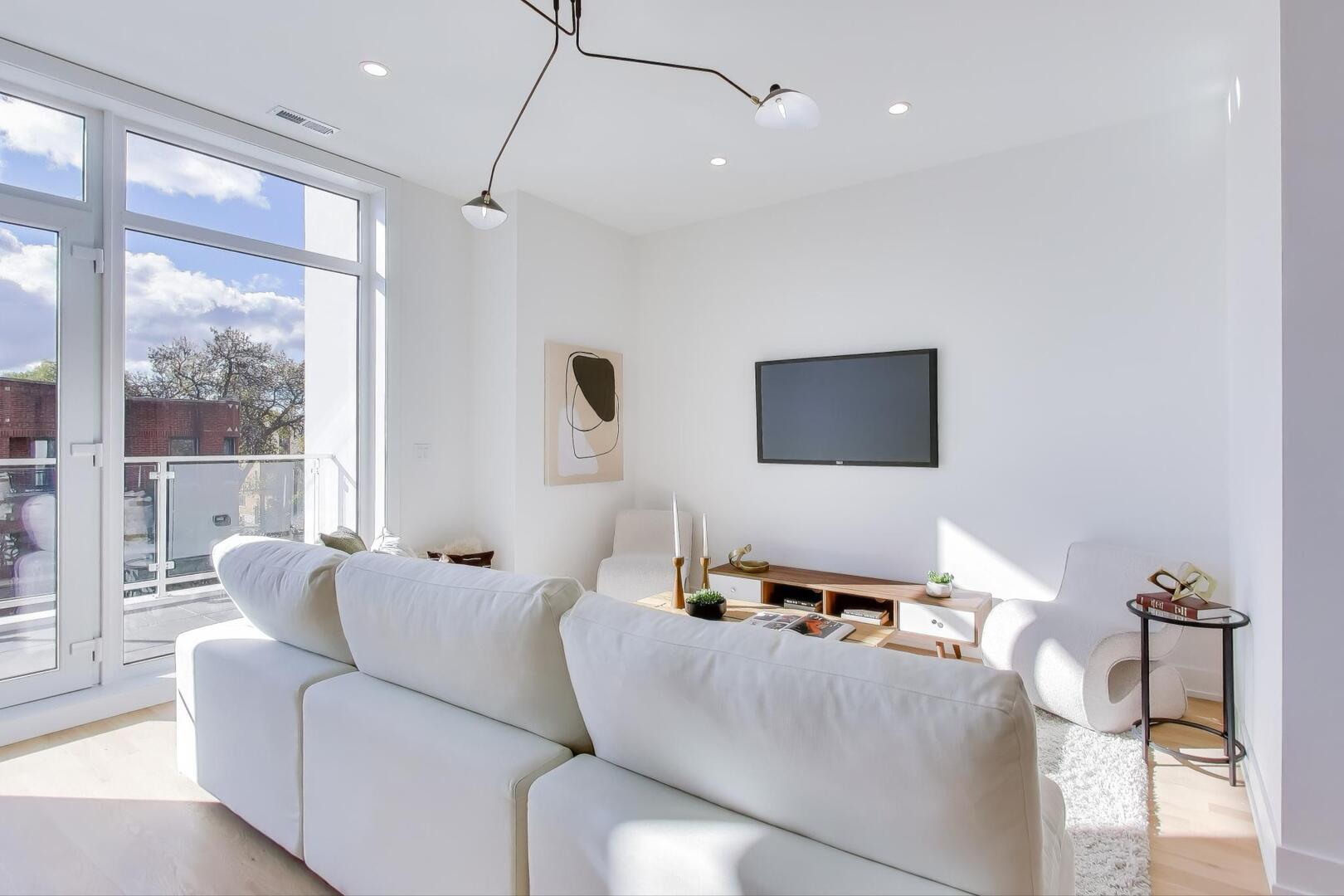2456 West Cortez Street, Unit 3E Chicago, IL 60622 - Photo 8 of 46 a living room with furniture and a flat screen tv