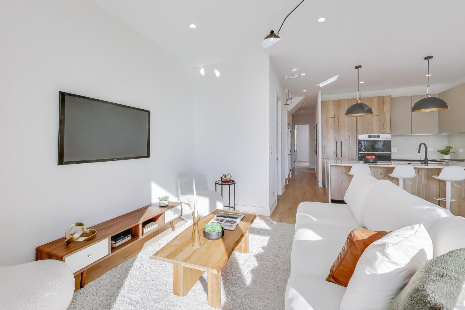 2456 West Cortez Street, Unit 3E Chicago, IL 60622 - Photo 9 of 46 a living room with furniture and a flat screen tv