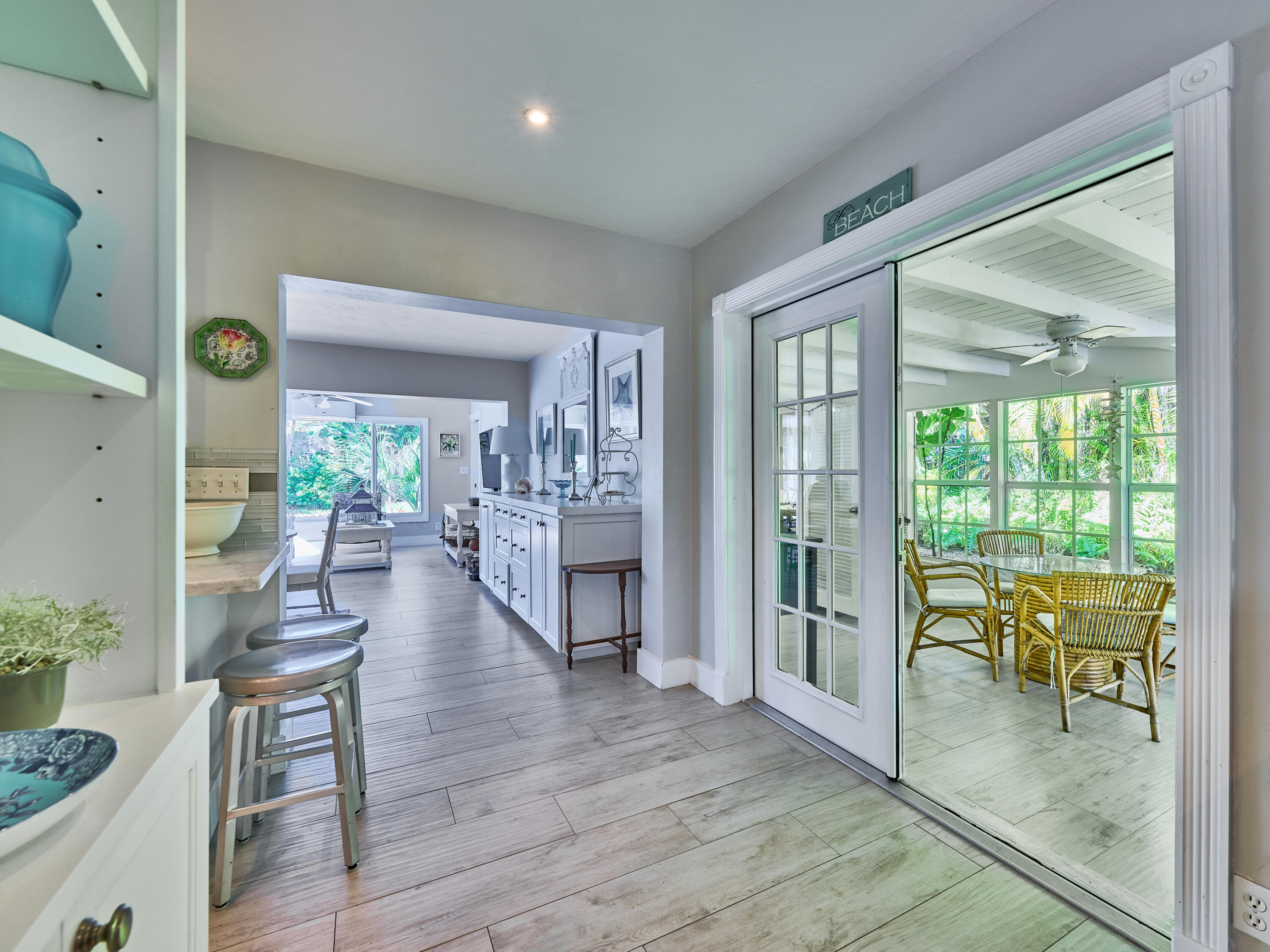 301 Northwest 3rd Court Boca Raton, FL 33432 - Photo 14 of 45 a dining room with furniture and a floor to ceiling window