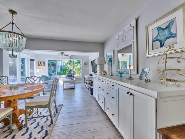 a kitchen with sink and view of living room