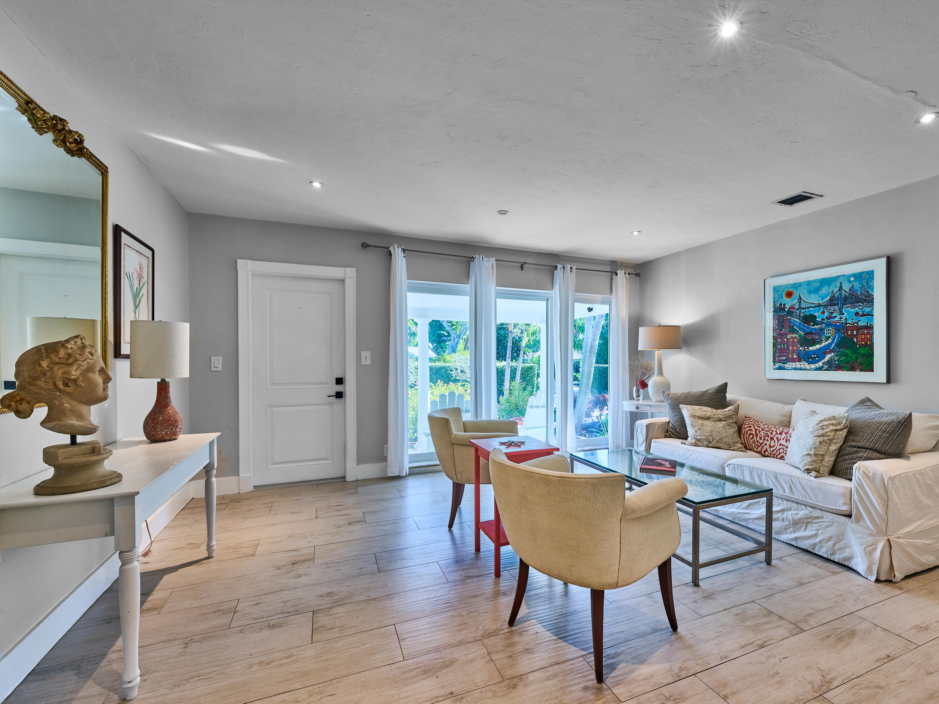301 Northwest 3rd Court Boca Raton, FL 33432 - Photo 2 of 45 a living room with furniture a rug and a large window