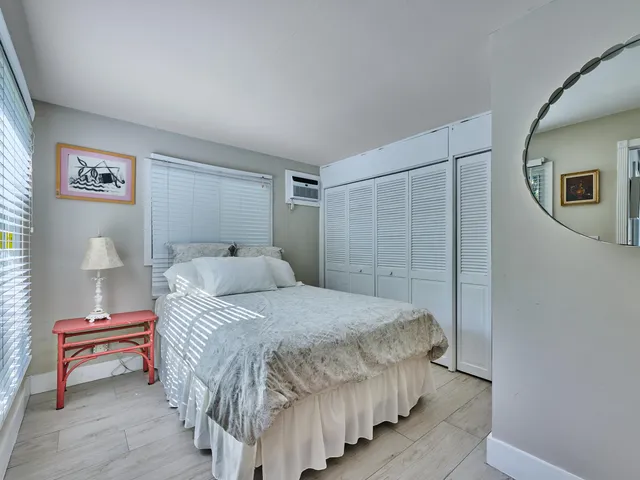 a bedroom with a bed and a table