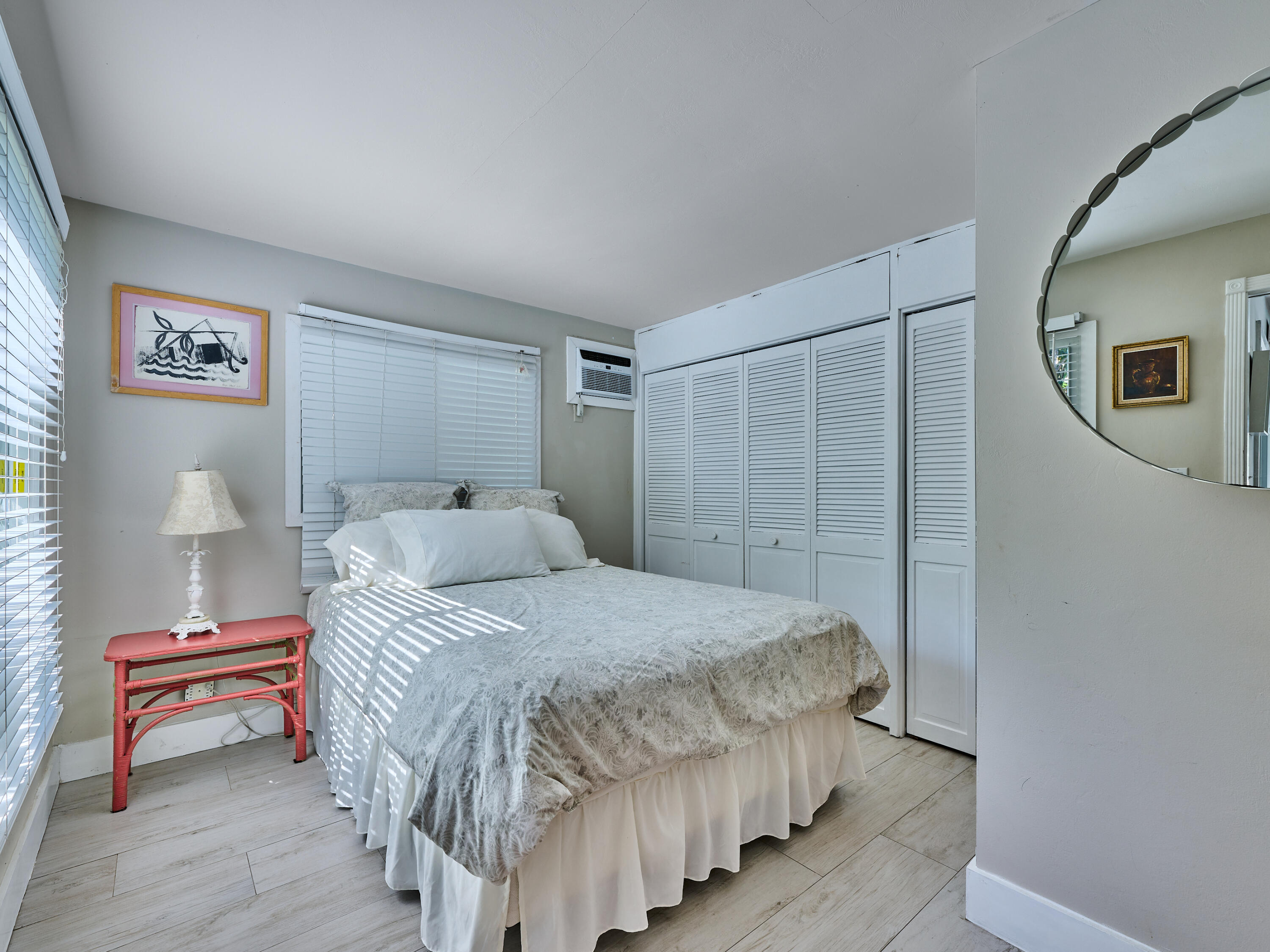 301 Northwest 3rd Court Boca Raton, FL 33432 - Photo 26 of 45 a bedroom with a bed and a table