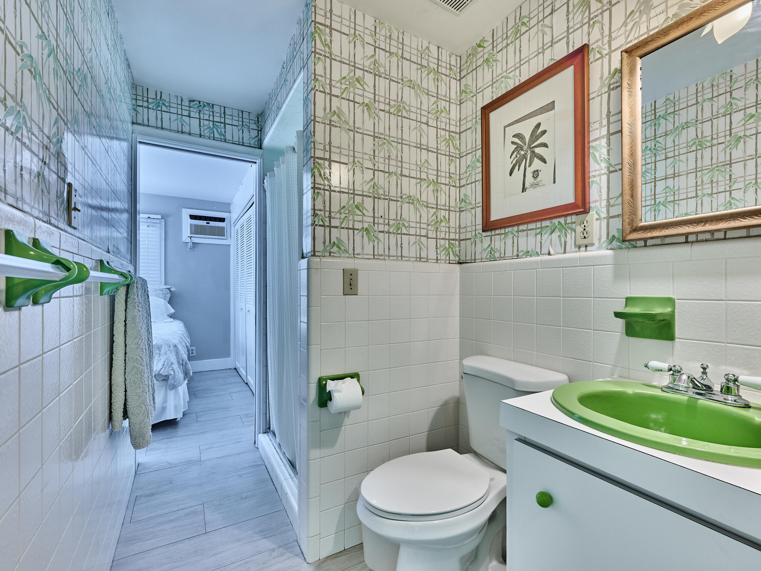 301 Northwest 3rd Court Boca Raton, FL 33432 - Photo 30 of 45 a bathroom with a sink a toilet and shower curtain