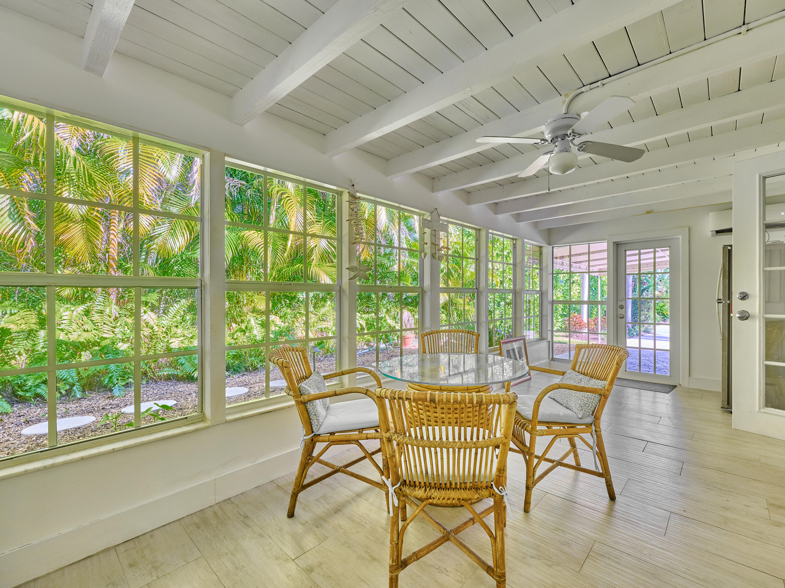 301 Northwest 3rd Court Boca Raton, FL 33432 - Photo 31 of 45 a dining room with furniture a chandelier and wooden floor