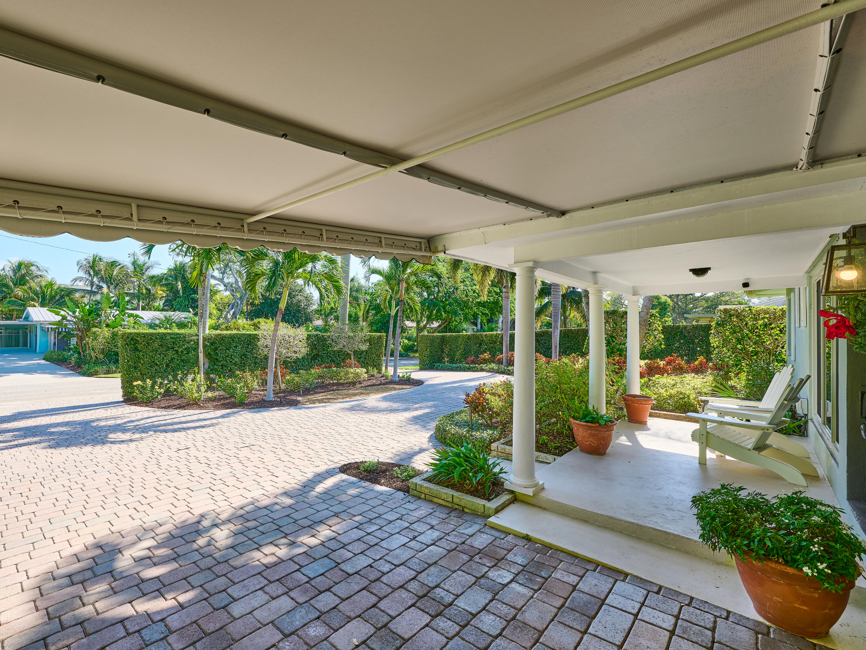 301 Northwest 3rd Court Boca Raton, FL 33432 - Photo 44 of 45 a view of a patio with chairs and floor to ceiling window