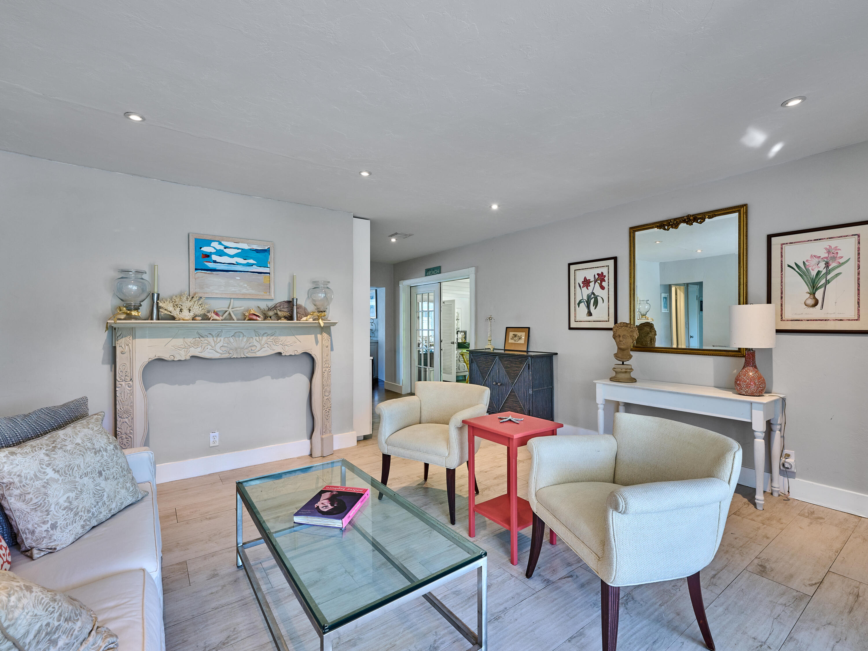 301 Northwest 3rd Court Boca Raton, FL 33432 - Photo 5 of 45 a living room with furniture and a fireplace