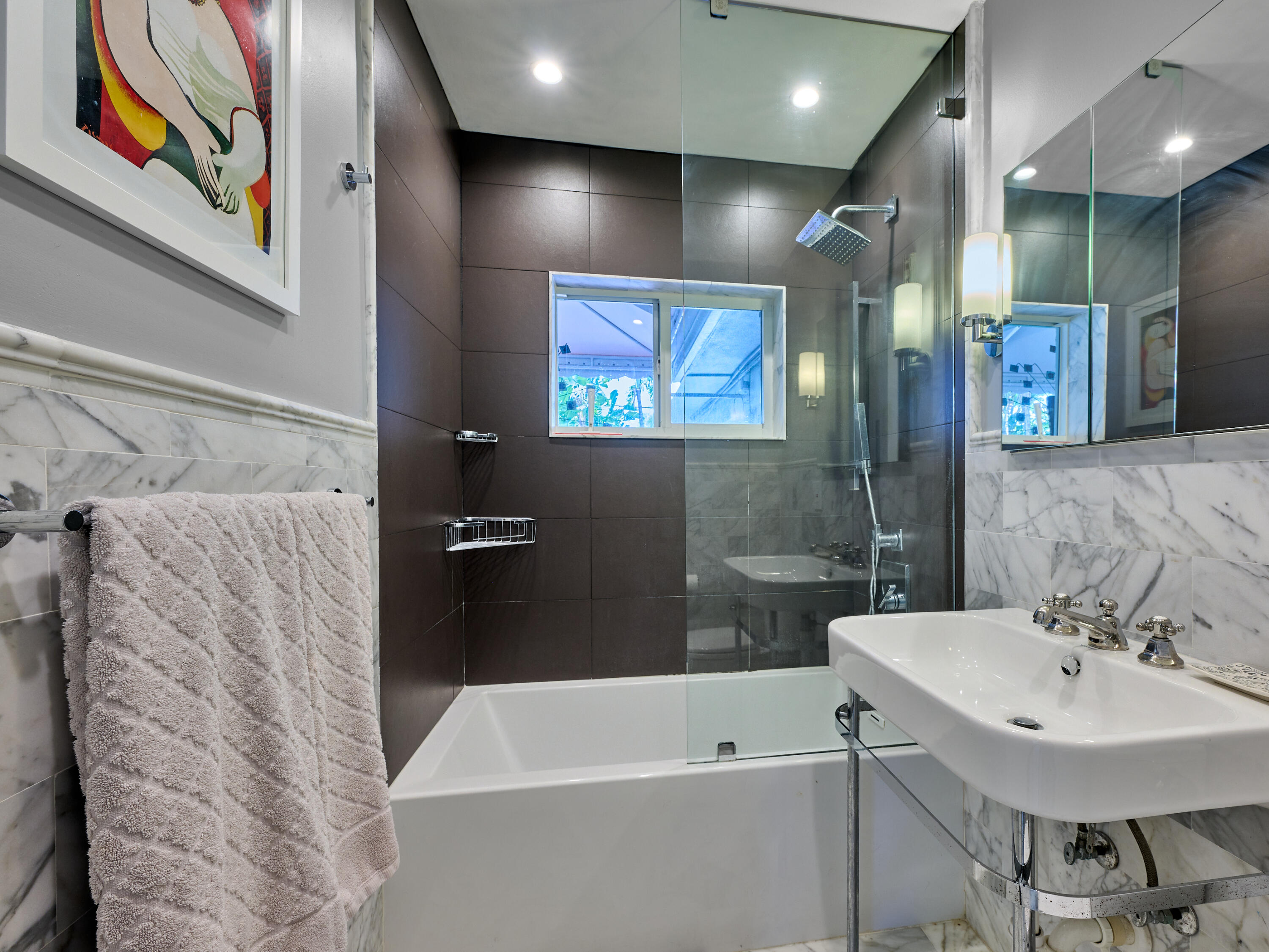 301 Northwest 3rd Court Boca Raton, FL 33432 - Photo 7 of 45 a bathroom with a sink and a bathtub