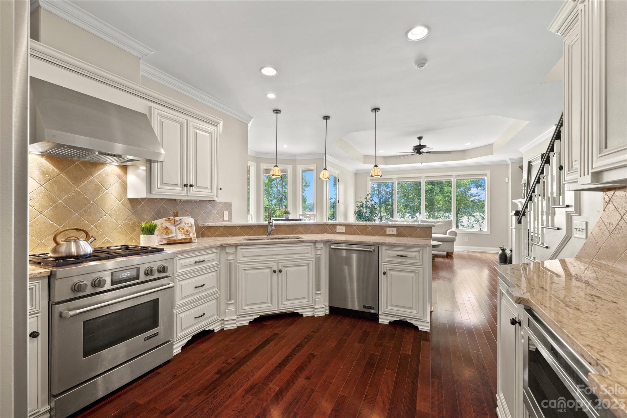 10285 Lakeshore Drive Lancaster, SC 29720 - Photo 19 of 48 a kitchen with stainless steel appliances white cabinets and wooden floor