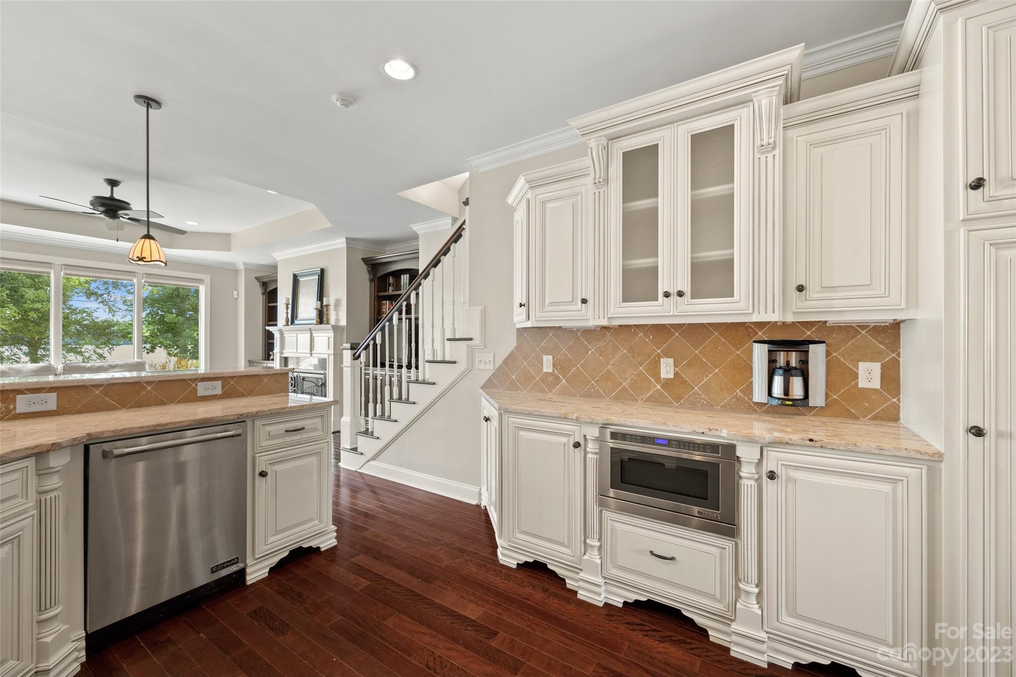 10285 Lakeshore Drive Lancaster, SC 29720 - Photo 21 of 48 a kitchen with granite countertop white cabinets and white appliances