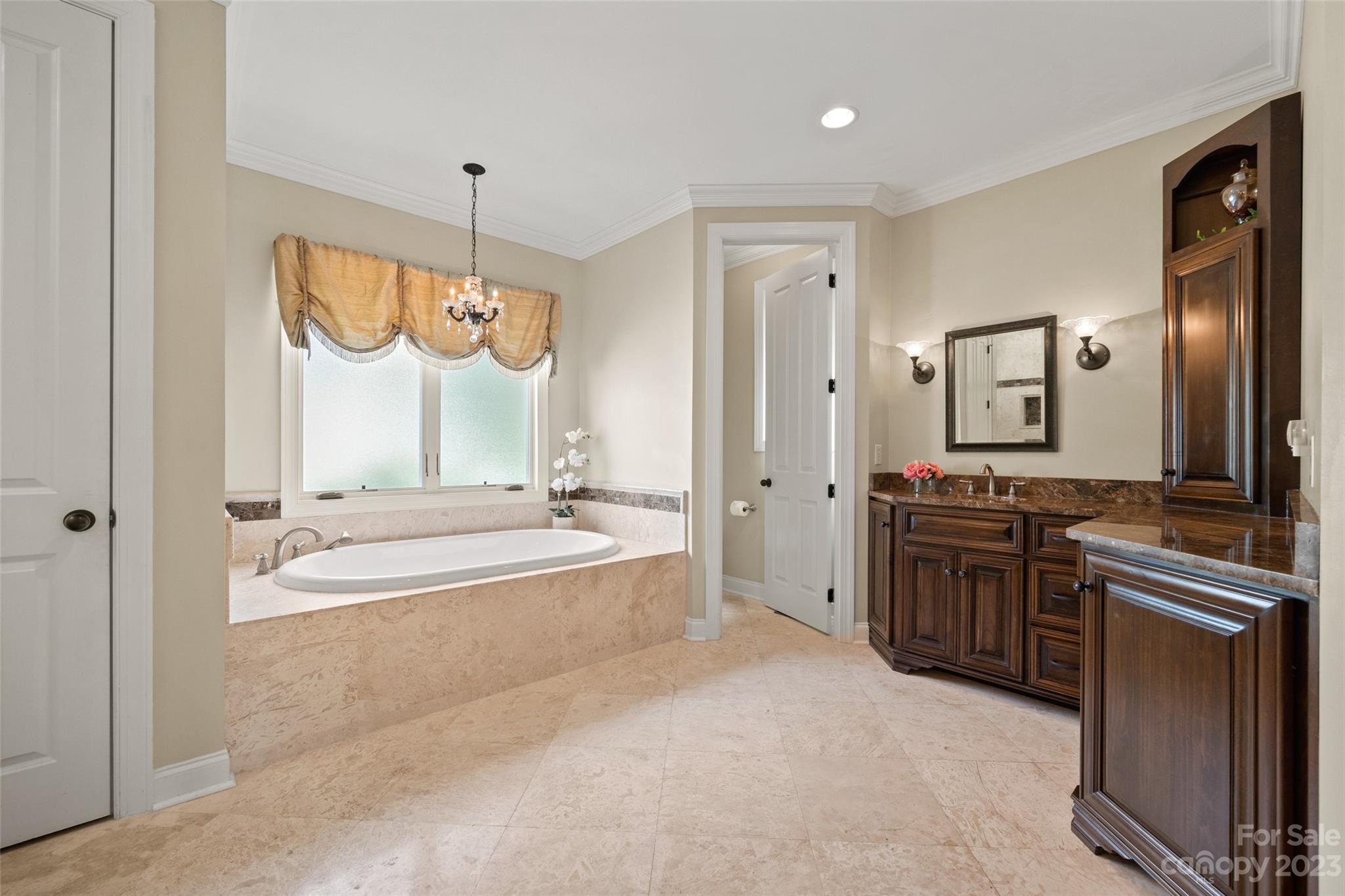 10285 Lakeshore Drive Lancaster, SC 29720 - Photo 29 of 48 a large spacious bathroom with a tub sink and mirror