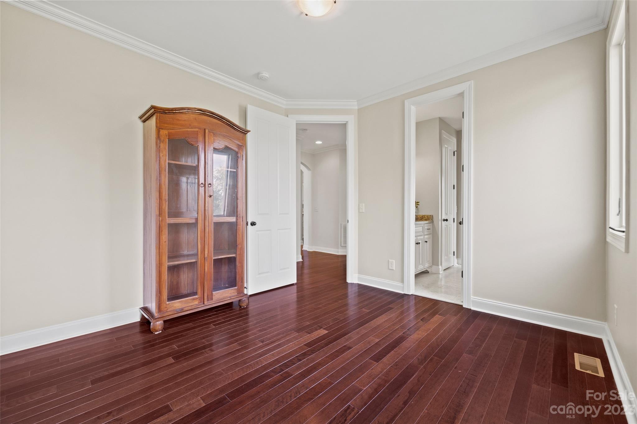 10285 Lakeshore Drive Lancaster, SC 29720 - Photo 32 of 48 an empty room with wooden floor and windows