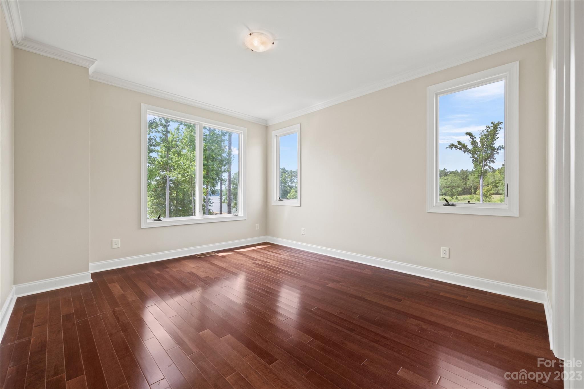 10285 Lakeshore Drive Lancaster, SC 29720 - Photo 33 of 48 a view of an empty room with wooden floor and a window